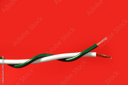 Two different electrical wires on red background. Space for text © New Africa