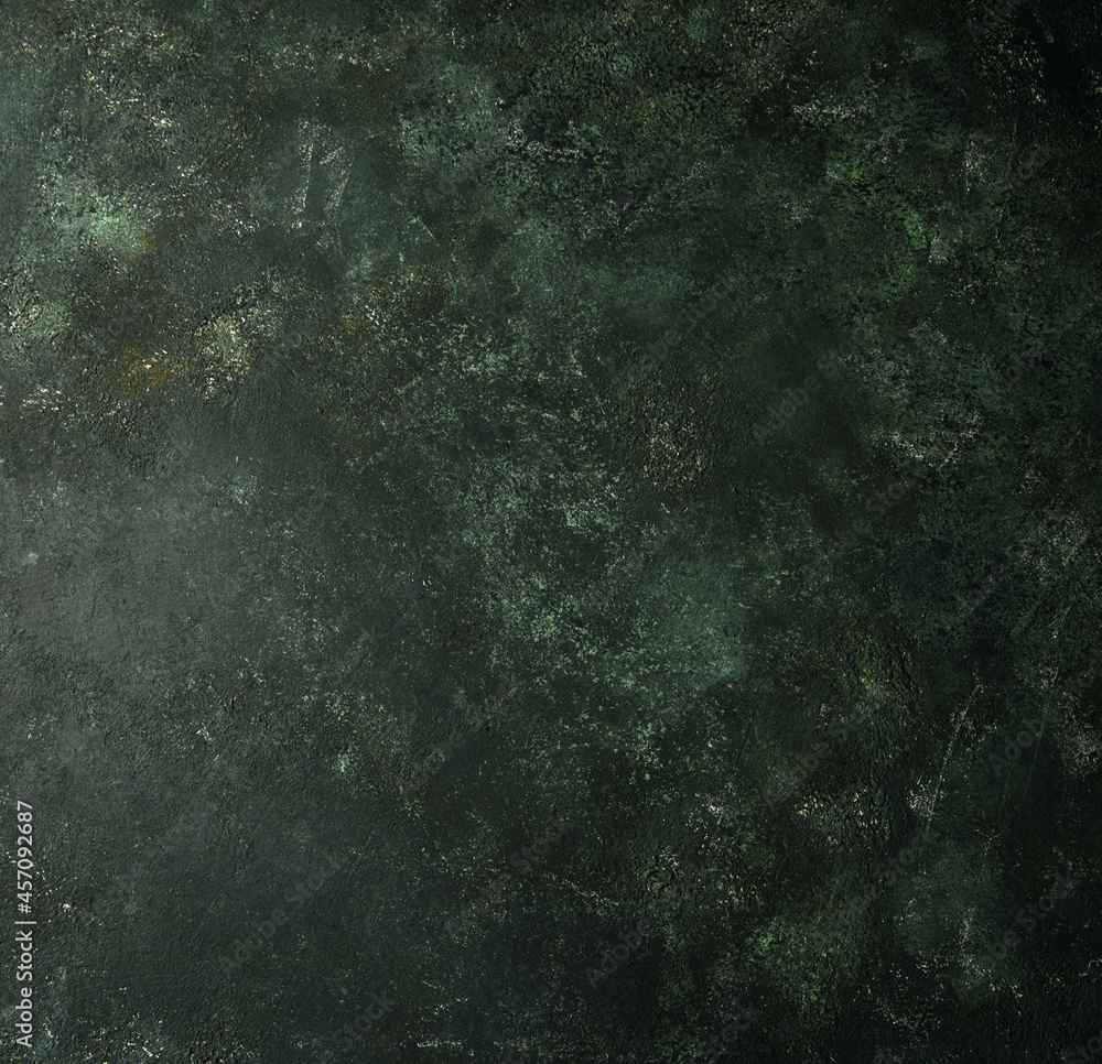 Beautiful dark green background. Panoramic abstract decorative dark background. Wide-angle rough stylized wallpaper with mystical texture with copy space for design.