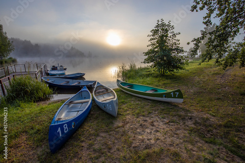Early morning. Fog on the river. Beautiful sunrise in the summer by the river. boats on the banks of the river