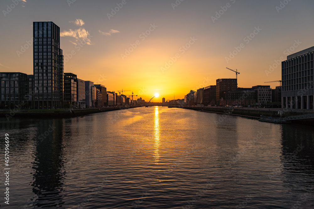 DUBLIN, IRELAND - 12 SEPTEMBER 2021: Sunset at Samuel Beckett Bridge crossing the River Liffey in Dublin, Ireland