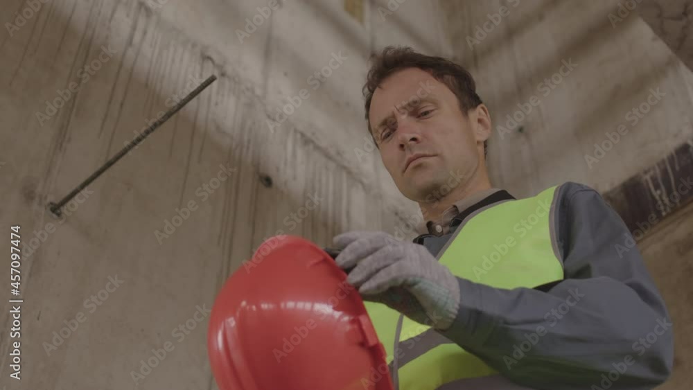 Low angle lockeddown of blueeyed Caucasian construction worker