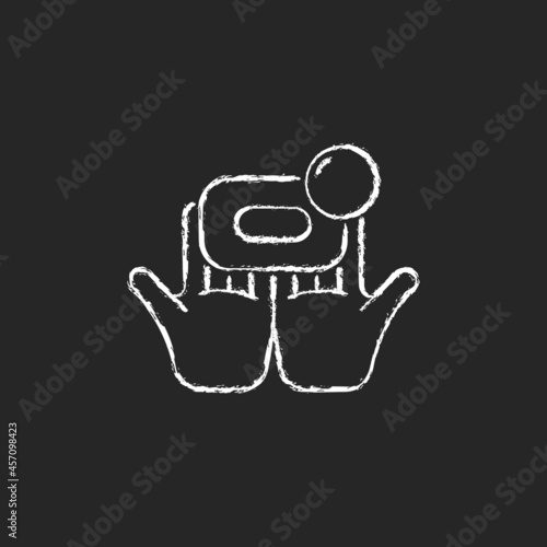 Washing with brick soap chalk white icon on dark background. Effectiveness against bacteria. Wetting bar soap with water. Getting hands clean. Isolated vector chalkboard illustration on black