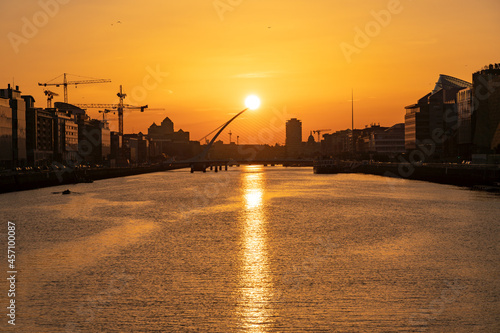 Photography DUBLIN, IRELAND - 12 SEPTEMBER 2021: Sunset at Samuel Beckett Bridge crossing th