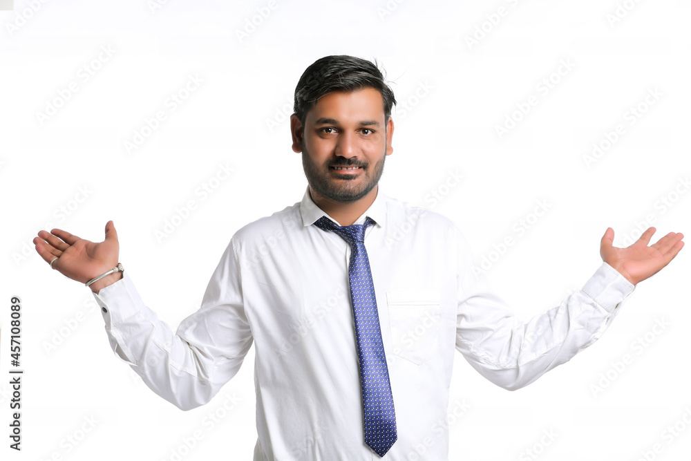 Young indian man showing expression on white background Young indian man showing expression on white background