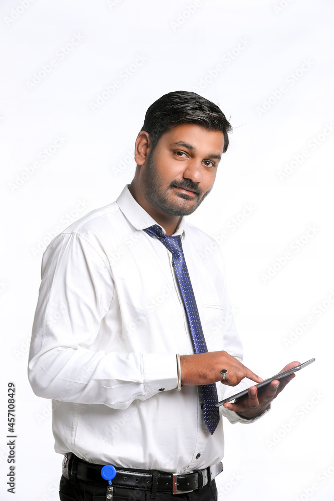 Young indian man using smartphone on white background. Young indian man using smartphone on white background.
