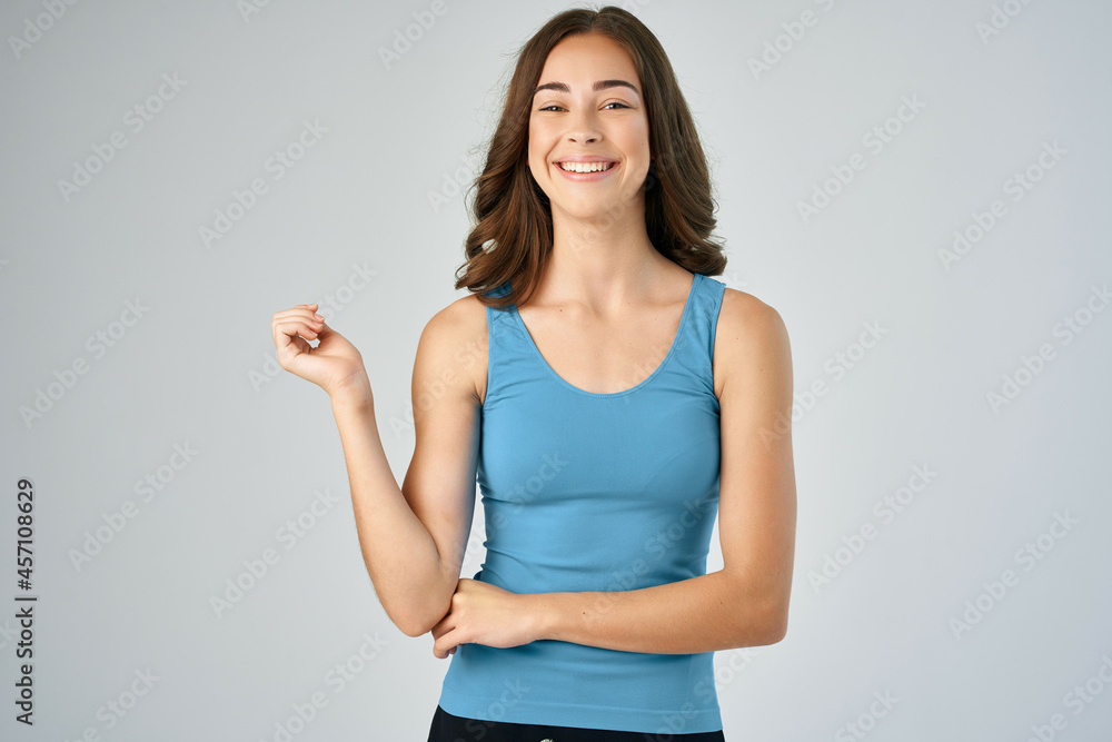 pretty brunette in blue tank top posing smile fashion pretty brunette in blue tank top posing smile fashion