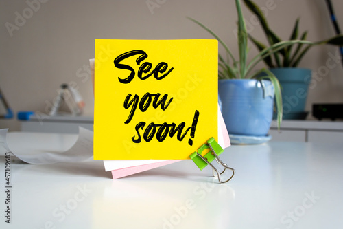 Photos "See You Soon" on Sticky Note