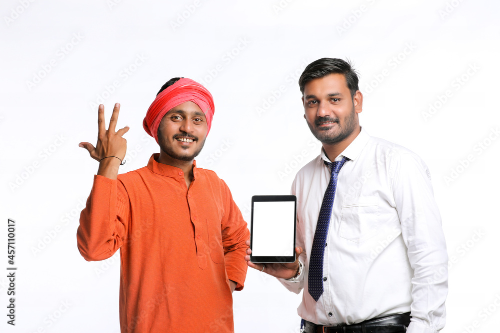 Indian Farmer showing tablet with bank officer or corporate government employee on white background. Indian Farmer showing tablet with bank officer or corporate government employee on white background.
