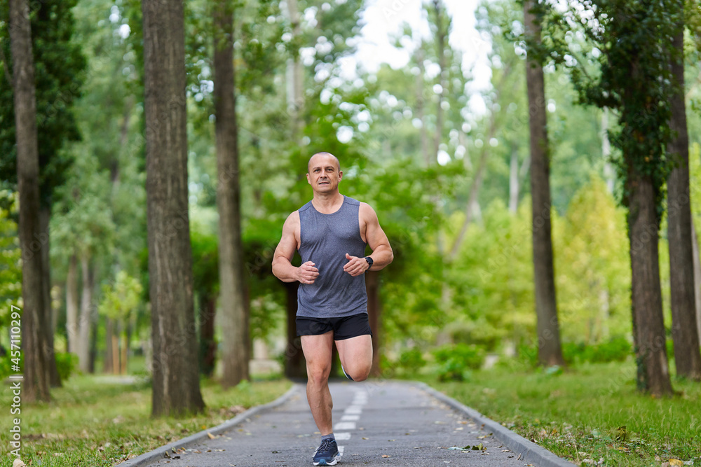 Long distance runner training in the park Long distance runner training in the park