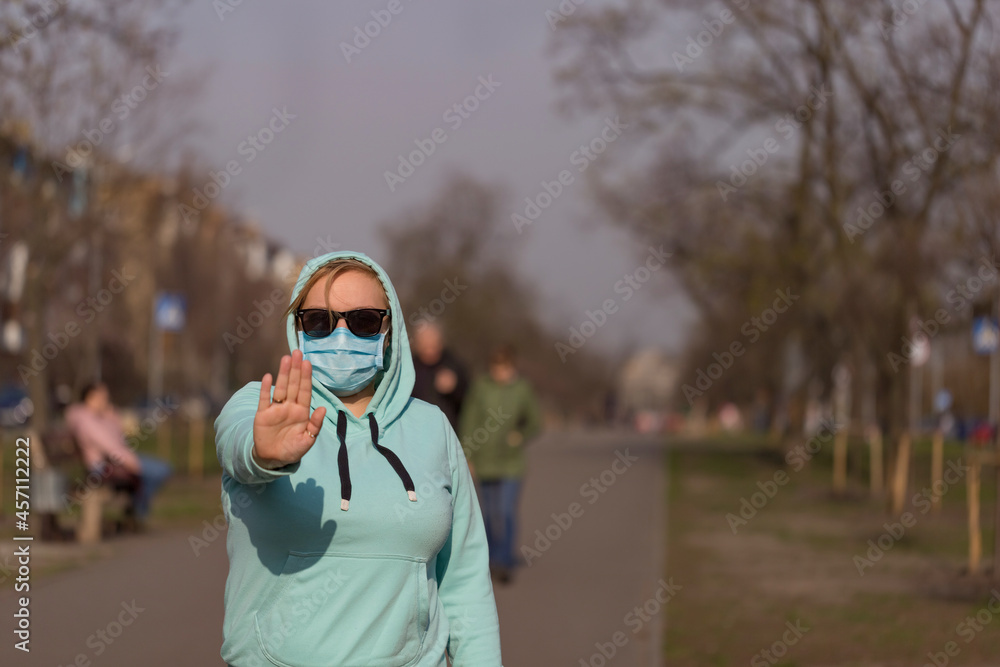 Global call to stay home. Girl wearing protective mask from disease Global call to stay home. Girl wearing protective mask from disease