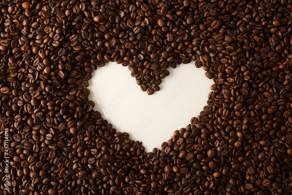 Coffee beans forming hollow of white heart top Coffee beans forming hollow of white heart top