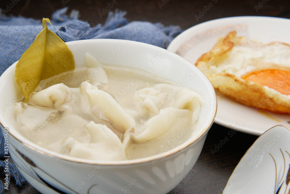 Dumpling Soup in a bowl on table, Dumpling Soup in a bowl on table,