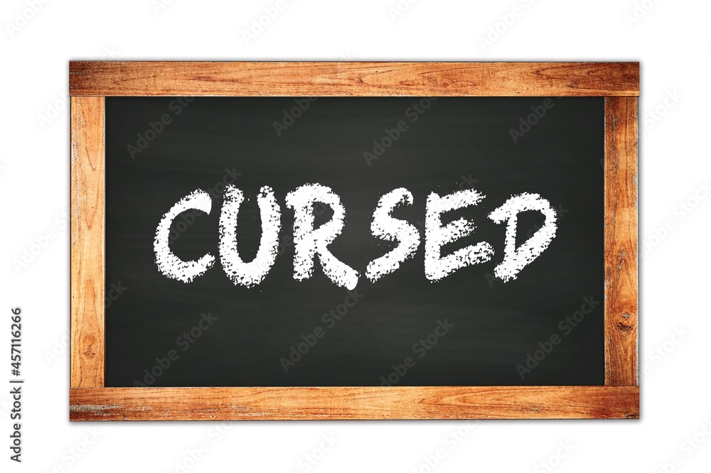 CURSED text written on wooden frame school blackboard. CURSED text written on wooden frame school blackboard.