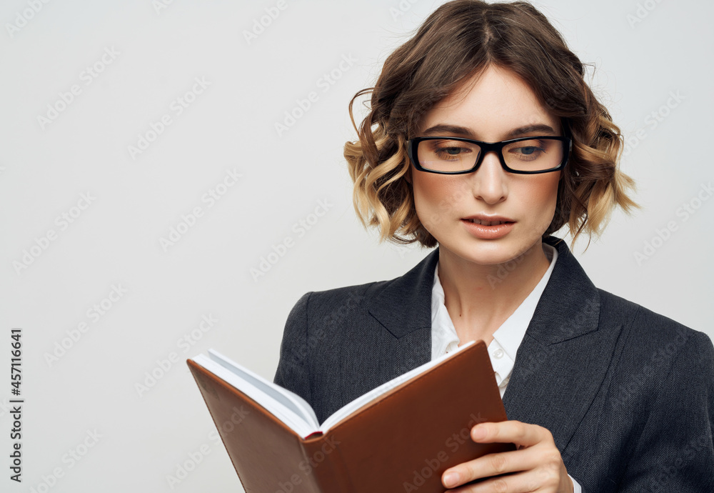 woman with glasses notebook in hand isolated background woman with glasses notebook in hand isolated background