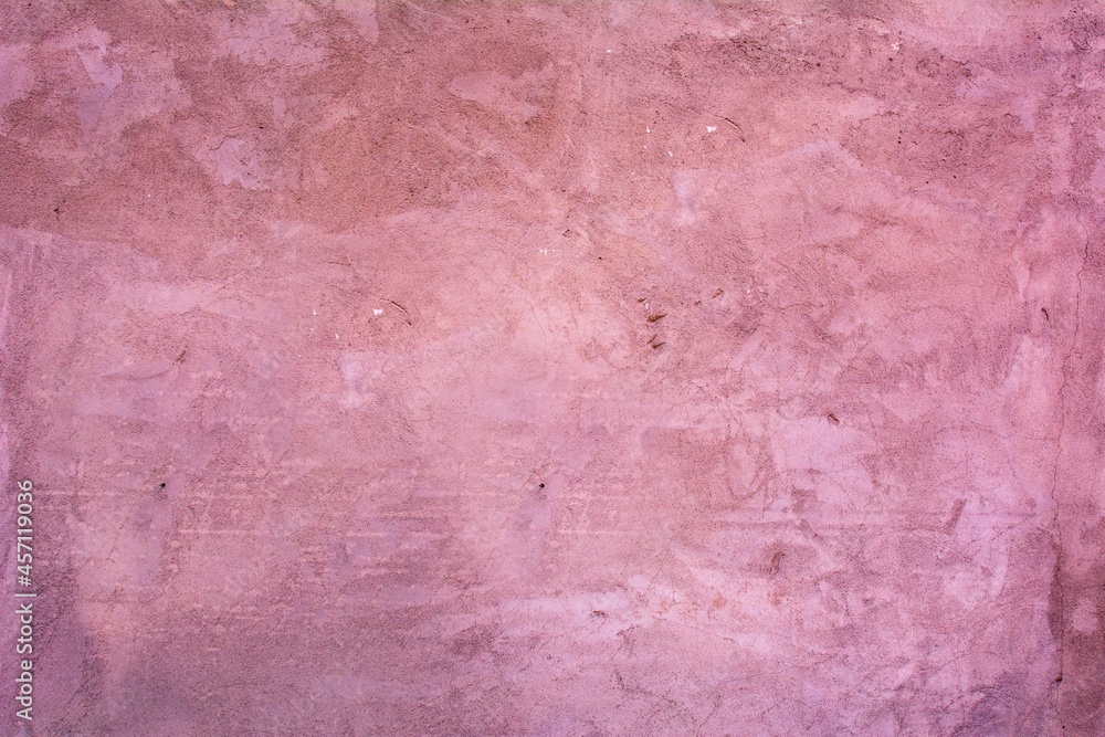 Old red wall in spots, cracks, stains. Painted concrete wall in abstract grunge style loft. Vintage wall background texture for backgrounds, portraits, posters. Old red wall in spots, cracks, stains. Painted concrete wall in abstract grunge style loft. Vintage wall background texture for backgrounds, portraits, posters.