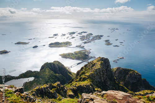 Top of mount Festvagtinden with views over the village of Henningsvaer. Henningsvaer is a fishing village located on several small islands in the Lofoten archipelago in Norway photo