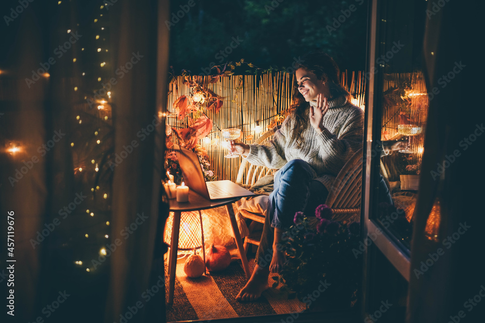 Online meeting with family and friends. Woman waves to relatives on holiday video call. Online meeting with family and friends. Woman waves to relatives on holiday video call.