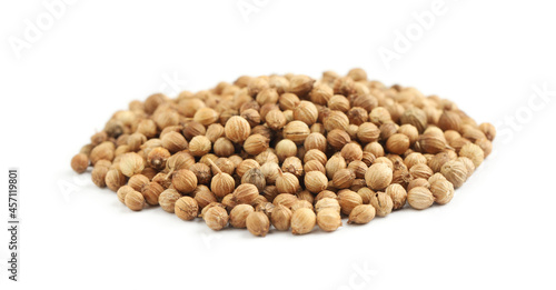 Heap of dried coriander seeds on white background