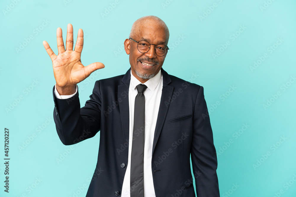 Business senior man isolated on blue background counting five with fingers Business senior man isolated on blue background counting five with fingers