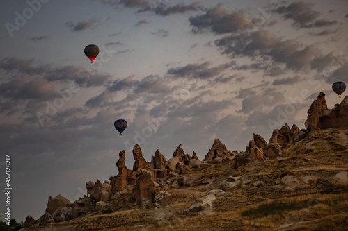 Cappadocia, Turkey - September 1, 2021 - Cappadocia Panoramic - Hot air balloon flying in early morning over rock landscape at Cappadocia Turkey