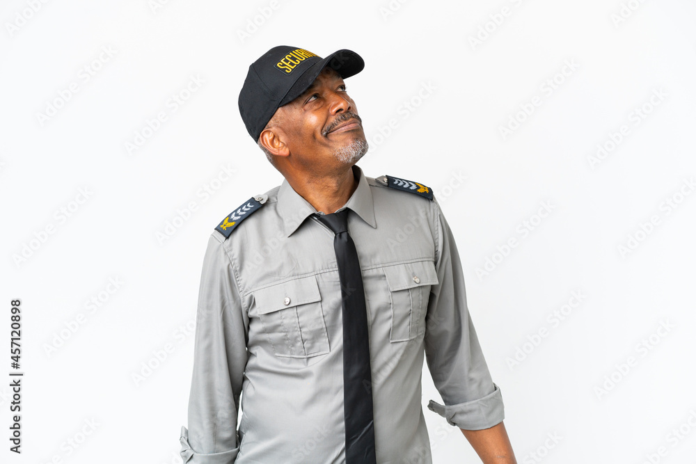 Fototapeta premium Senior staff man isolated on white background and looking up