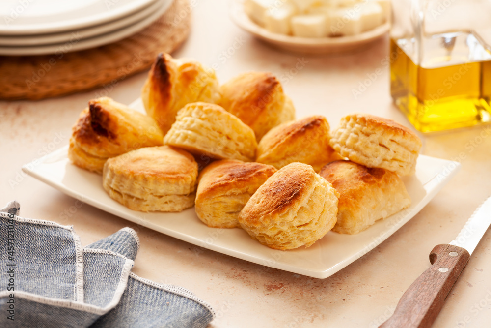 Bunch of small homemade greek cheese puff pastry pies Bunch of small homemade greek cheese puff pastry pies