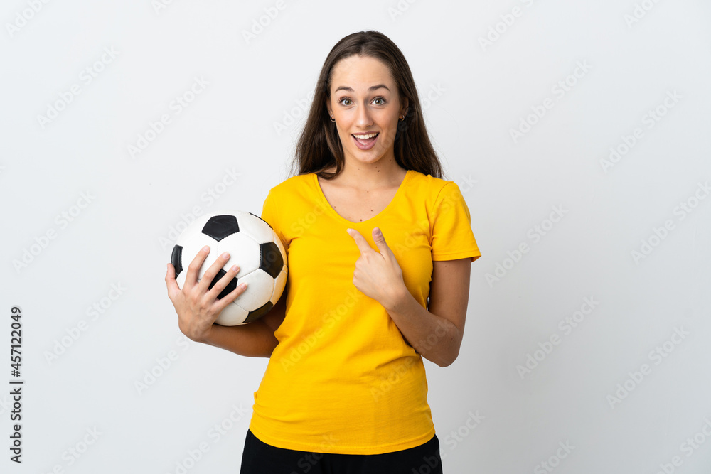 Young football player woman over isolated white background with surprise facial expression Young football player woman over isolated white background with surprise facial expression