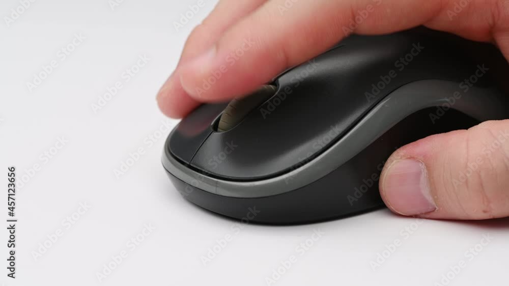 Clicking digital wireless mouse and working on computer at the office. Close up hand on mouse. The concept of using technology for rapid success. Computer lab. Cyber business.4k Clicking digital wireless mouse and working on computer at the office. Close up hand on mouse. The concept of using technology for rapid success. Computer lab. Cyber business.4k