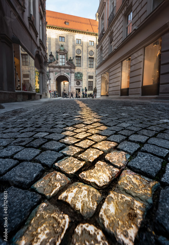 Obraz na plátně Golden cobblestones at Viscardigasse - people used this alley to avoid giving a