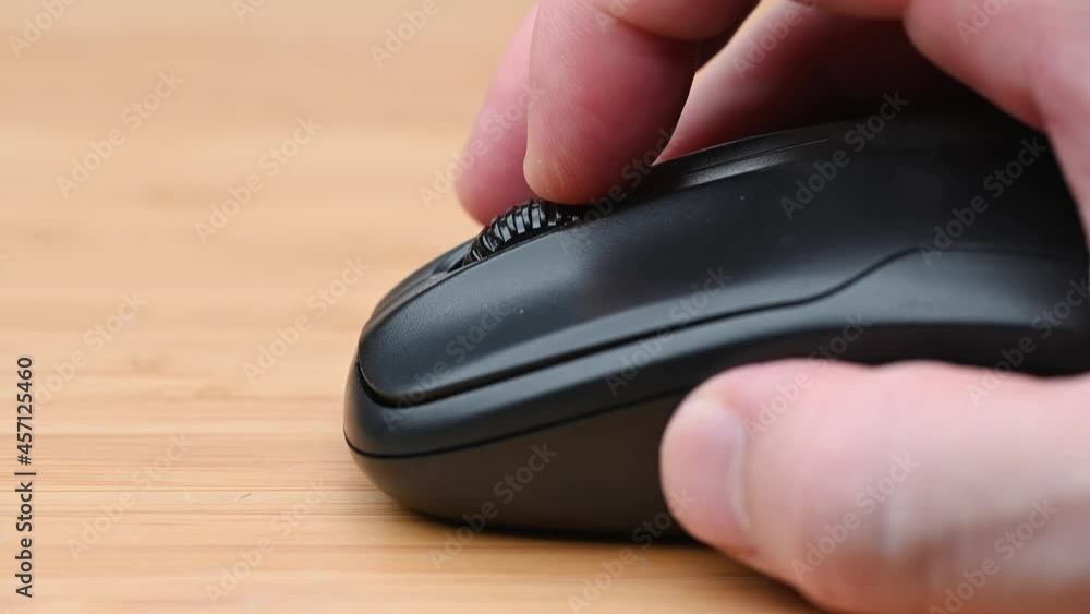 Clicking digital wireless mouse and working on computer at the office. Close up hand on mouse. The concept of using technology for rapid success. Computer lab. Cyber business.4k Clicking digital wireless mouse and working on computer at the office. Close up hand on mouse. The concept of using technology for rapid success. Computer lab. Cyber business.4k