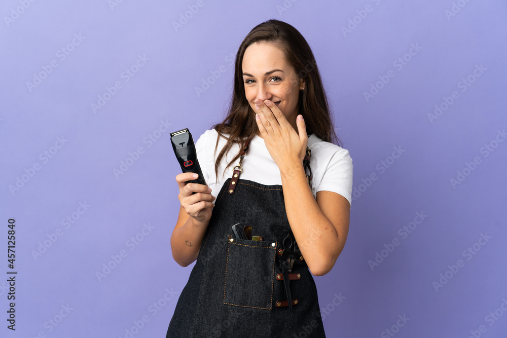 Young hairdresser woman over isolated background happy and smiling covering mouth with hand Young hairdresser woman over isolated background happy and smiling covering mouth with hand