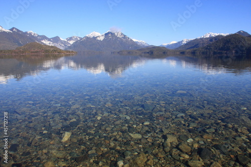 Snow capped mountains and a clear lake on Vancouver Island, British Columbia (BC), Canada