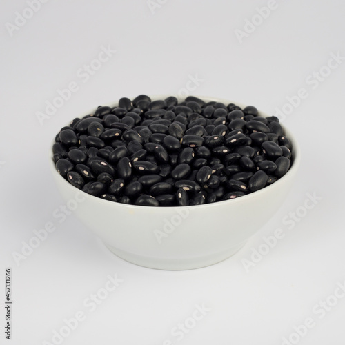 Black Beans on round pot on white background