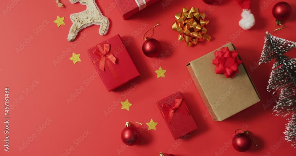 Christmas decorations with presents and copy space on red background Christmas decorations with presents and copy space on red background