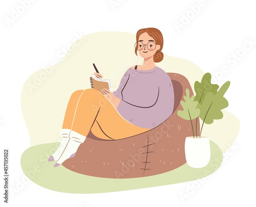 Young woman in bag chair studying. Student girl writing in notebook, journaling. Hygge home atmosphere. Flat vector illustration