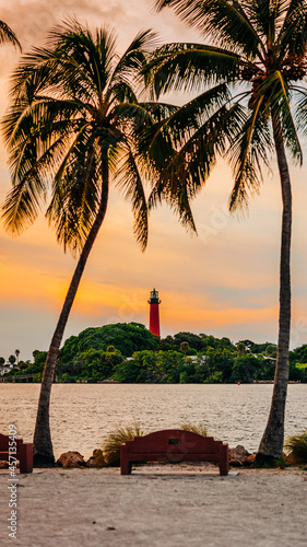 Historic Jupiter Lighthouse surrounded by palm trees in Jupiter, Florida photo