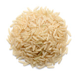 close up of uncooked long brown rice isolated on white, top view