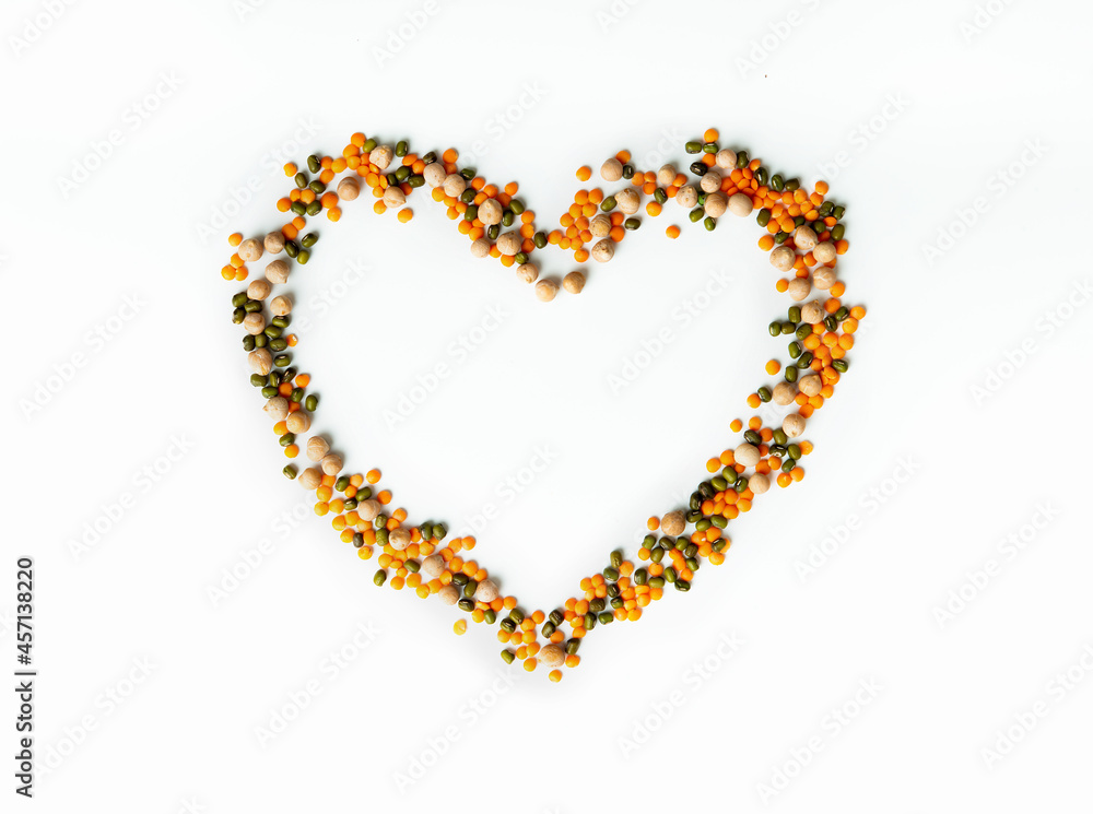 Set dry seeds of peas, lentils, beans, fomed heart shape. Isolated on white background