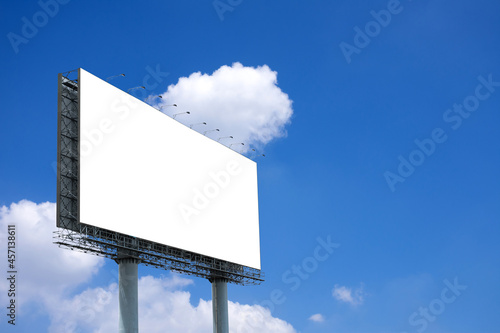 Blank billboard mockup with white screen on blue sky and clouds background. Clipping path on screen include in this image. Copy space for present your products banner advertisement.