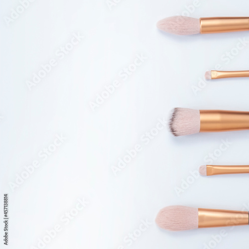 Makeup brushes on white background. Copy space