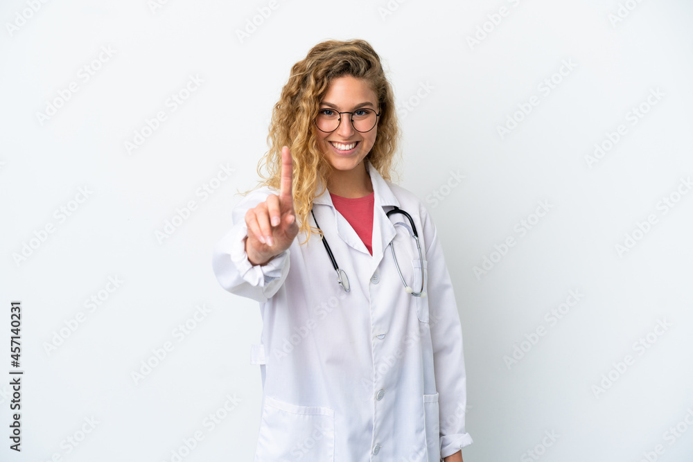 Young doctor blonde woman isolated on white background showing and lifting a finger Young doctor blonde woman isolated on white background showing and lifting a finger
