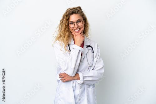 Young doctor blonde woman isolated on white background happy and smiling