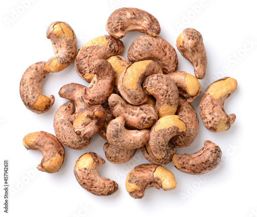 roasted cashew nuts with peel isolated on the white background, top view