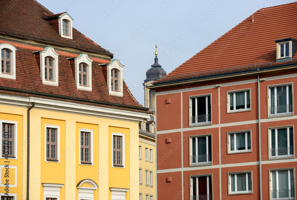 Narrow gap between bright buildings and Frauenkirche in it, Dresden.