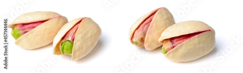 unpeeled pistachios isolated on the white background