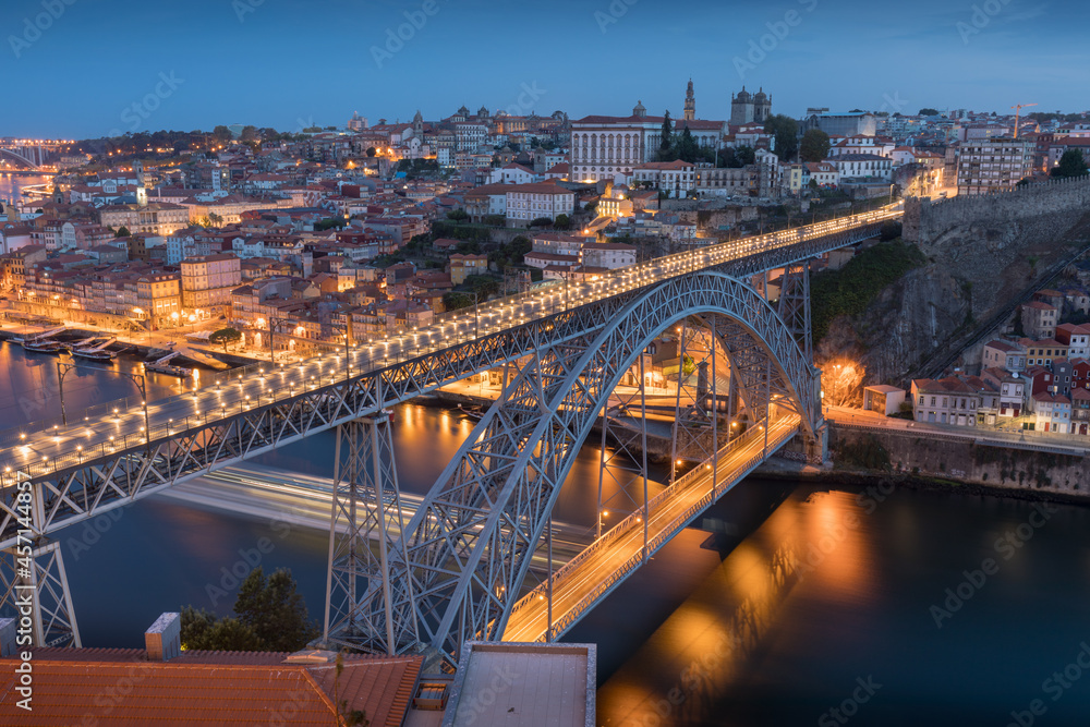 Fototapeta premium Porto, Portugal. Panoramic cityscape image of Porto, Portugal with the famous Luis I Bridge and the Douro River during amazing sunset.