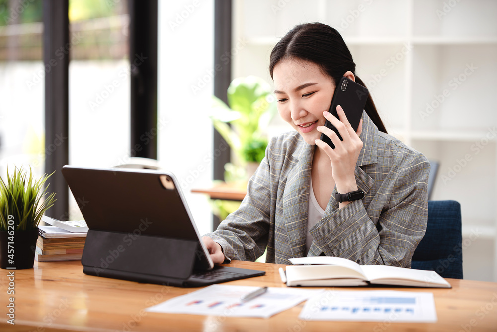 Business woman talking on the phone, laptop, computer, business technology concept. Business woman talking on the phone, laptop, computer, business technology concept.
