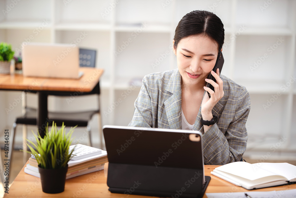 Business woman talking on the phone, laptop, computer, business technology concept. Business woman talking on the phone, laptop, computer, business technology concept.