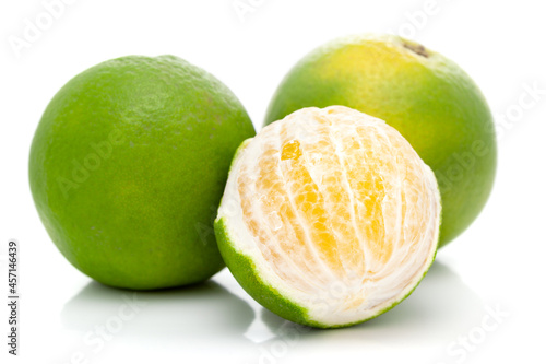 Close-up of Organic Indian Citrus fruit sweet limetta or mosambi (Citrus limetta) peeled by hand , it is an green and yellow in color, isolated over white background, photo