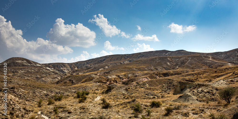 Cappadocia, Turkey - September 1, 2021 – Impressive nature by chimney rock formations and rock pillars of “love Valley” near Goreme, Cappadocia, Nevsehir, Turkey